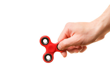Male hand holding red spinner isolated on white background