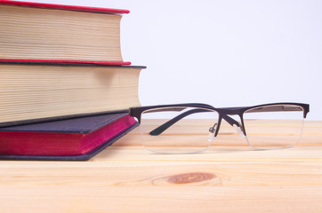 Book with glasses, education concept.