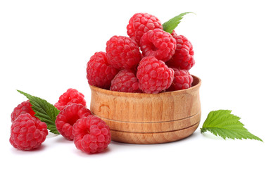 ripe raspberries in wooden bowl isolated on white background close up