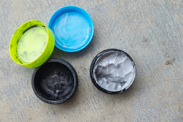 Open hair wax and clay in tubs