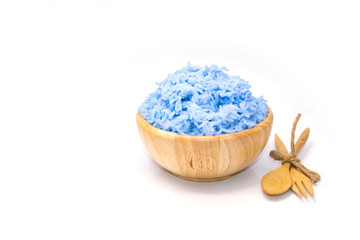 Rice cooked with blue butterfly pea in wooden bowl isolated on white