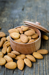 Almonds on the old wooden background