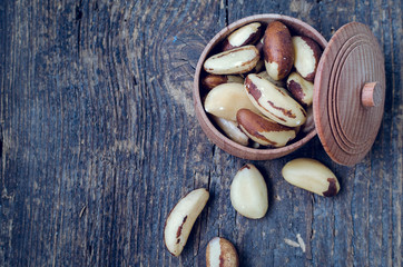 Brazil nuts on the old wooden background