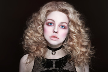 Beautiful girl with curly hair and white mascara