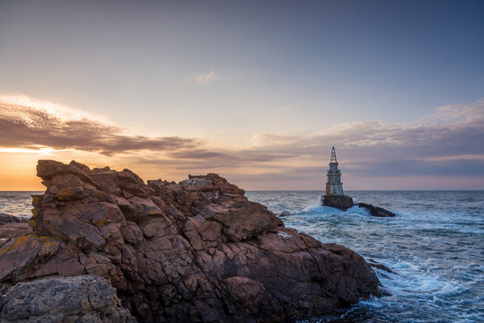 Fototapeta Sunrise at the lighthouse in Ahtopol, Bulgaria