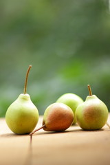 Pears on the background of a green bokeh