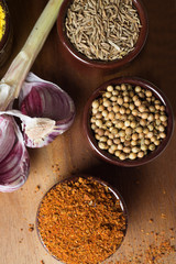 Spices and herbs in ceramic bowls. Food and cuisine ingredients. Colorful natural additives.