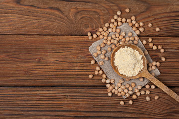 Chickpea flour in a wooden spoon