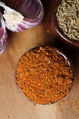 Spices and herbs in ceramic bowls. Food and cuisine ingredients. Colorful natural additives.