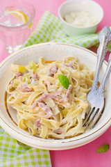 Pasta Carbonara style with bacon, cheese and courgette zucchini