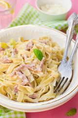 Pasta Carbonara style with bacon, cheese and courgette zucchini