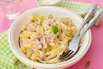 Pasta Carbonara style with bacon, cheese and courgette zucchini