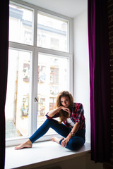 Young beauty Woman relax on windowsill background