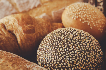 Bread background, closeup of white, black and rye loaves