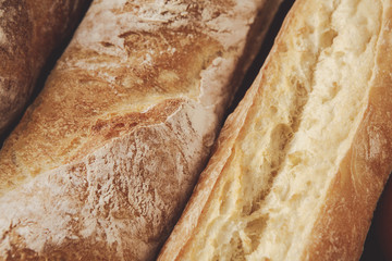 Bread texture background, closeup of baguette loaf