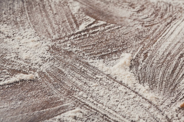 Baking concept on wood background, sprinkled flour with copy spa