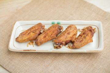 Fried chicken wings and crispy garlic in plate