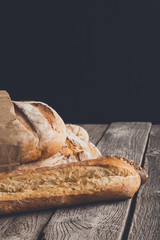 Bread background with copy space on rustic wood
