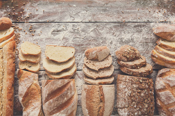 Bread bakery background. Brown and white wheat grain loaves comp
