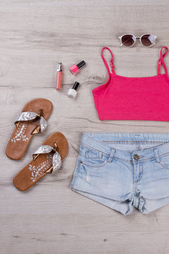 Fashionable top with shorts and accessories.