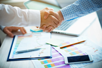 businessmen shaking hands in the office.