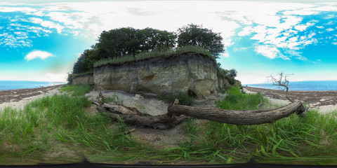 Fototapeta na wymiar 360 degrees spherical panorama of the beach with cliffs of the Island poel in Germany with blue sky