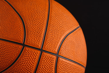 Basketball ball on black background closeup