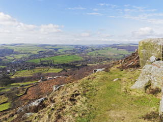 From high in the Peak District, on a bright spring day, the fields, woodlands and towns of Derbyshire stretch to the horizon.