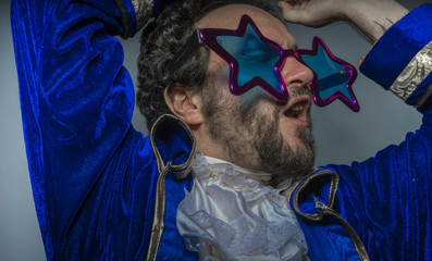 Hipster, Man with beard dressed like a pirate and ridiculous glasses, funny and humorous, costume party