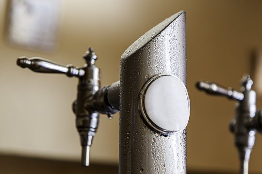 Cold beer tap in summer