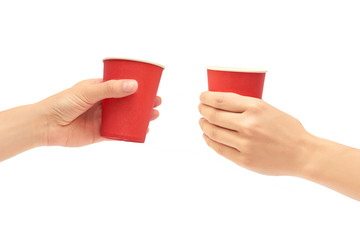 Female hands hold a cardboard or plastic disposable cup. Isolated on white background