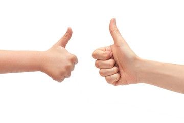 hand of young girl and kids hand gesture, shows thumbs up. Isolated on white background