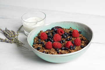 Healthy oat and almond flour berry crumble with soja yogurt