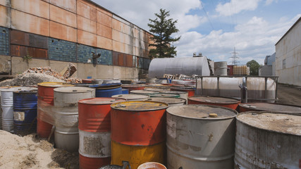 Barrels stand with spent oil products