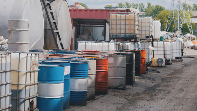 Barrels stand with waste oil and oil products