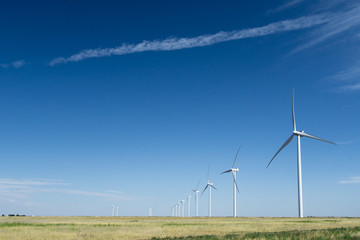 a row of wind turbines on a wind farm in Texas