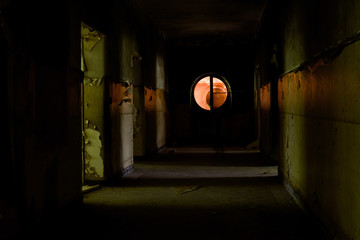 Scary shabby corridor of the abandoned building in Germany near Potsdam 