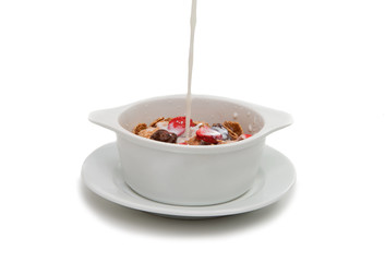 Muesli with chocolate and strawberries in milk
