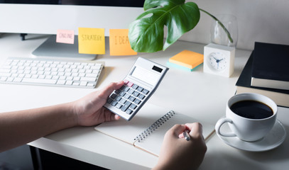 People working with calculator on worktable office. business plan, financial concept