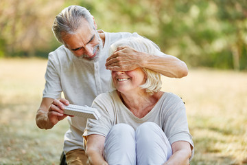 Old man surprises woman with a gift