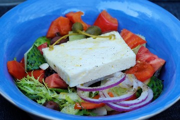 Delicious Greek salad with cheese and onions 