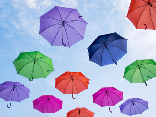 Fototapeta na wymiar Many umbrellas against blue sky.