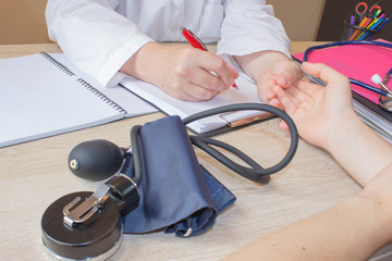 Doctor Writing application form while consulting patient. Medical and Health care concept