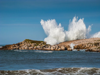Big wave over the rocks