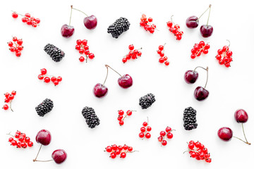 Berry pattern. Red currant, blackberry and cherry on white background top view