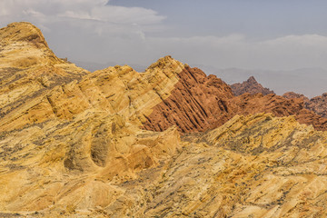Fototapeta premium Valley of Fire State Park with 40,000 acres of bright red Aztec sandstone outcrops nestled in gray and tan limestone IV