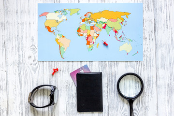 Planning trip. World map and bank card on wooden table background top view copyspace