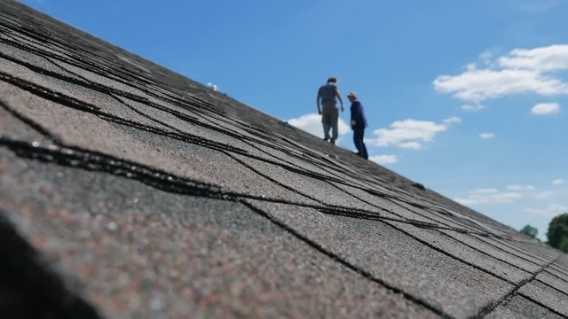 Construction of the roof. Soft roof, shingles. Roofer.