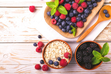 Raspberry, blueberry with mint and oatmeal breakfast or smoothie.