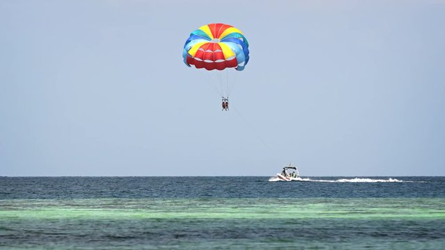 Speedboat Towing Parasail off Maafushi Island in the Maldives
